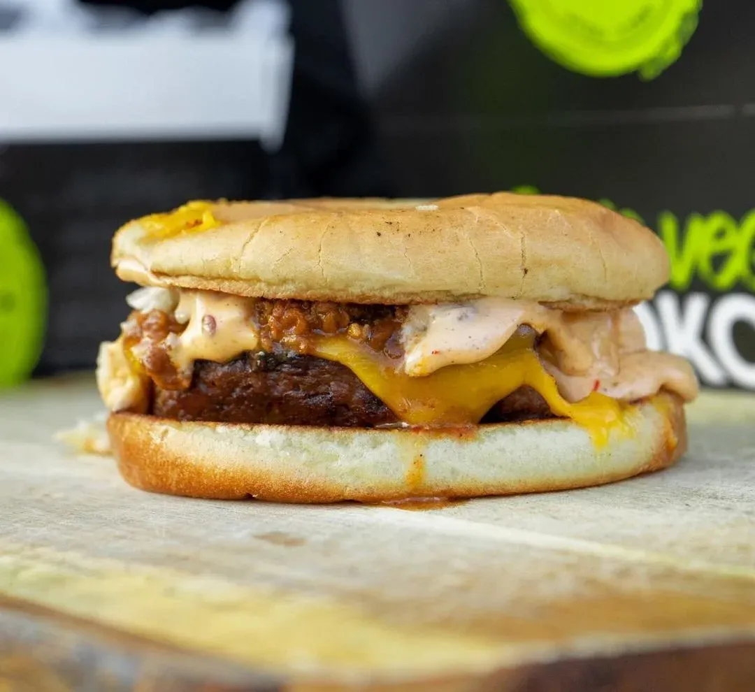 Vegan cheeseburger with chili and melted cheese