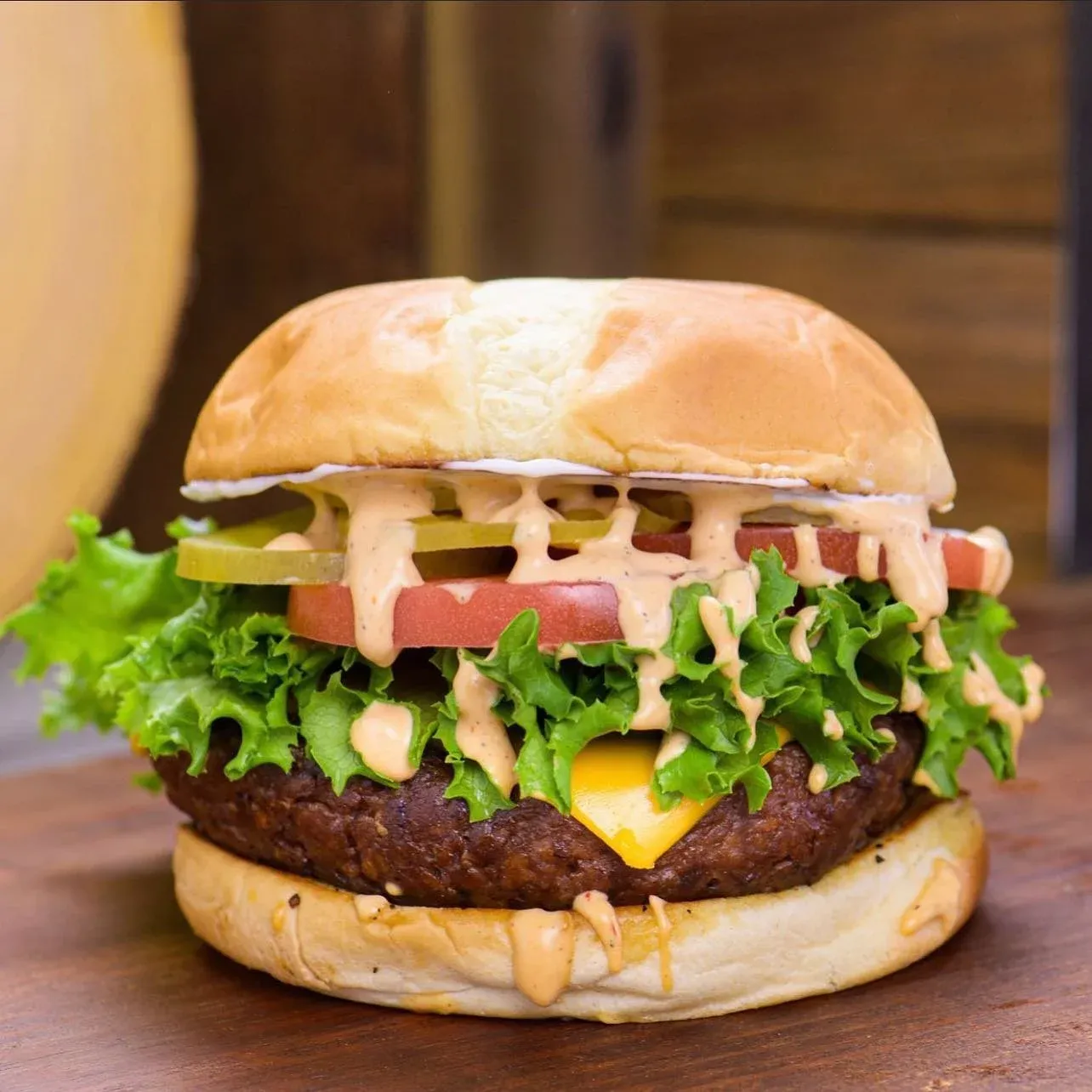 Vegan cheeseburger with lettuce, tomato and special sauce