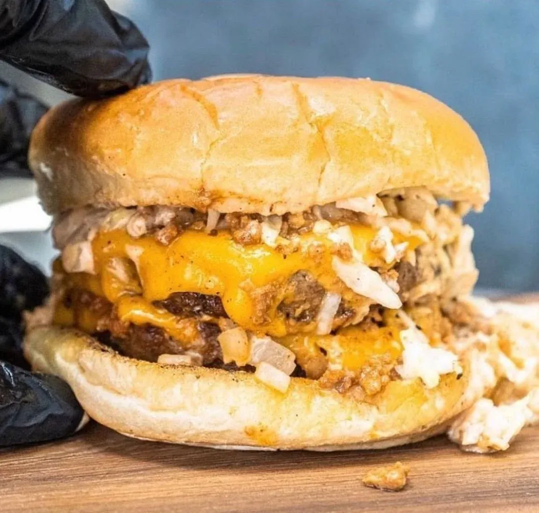 Double vegan cheeseburger loaded with crispy toppings